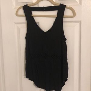Black tank top with sheer design in center.